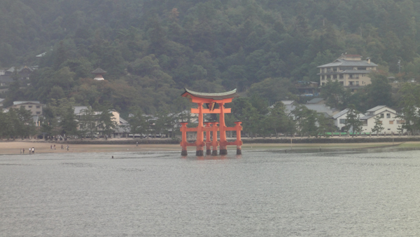 torii gate in the distance in the water